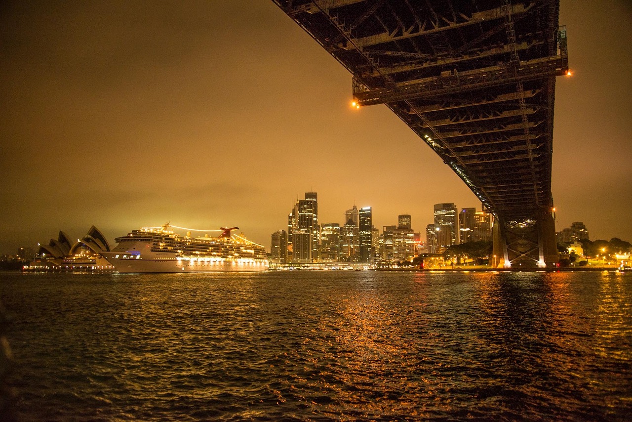 a bridge over a body of water with a city in the background, a picture, by Dan Scott, pexels contest winner, happening, manly, on ship, 2 4 mm iso 8 0 0, usa-sep 20