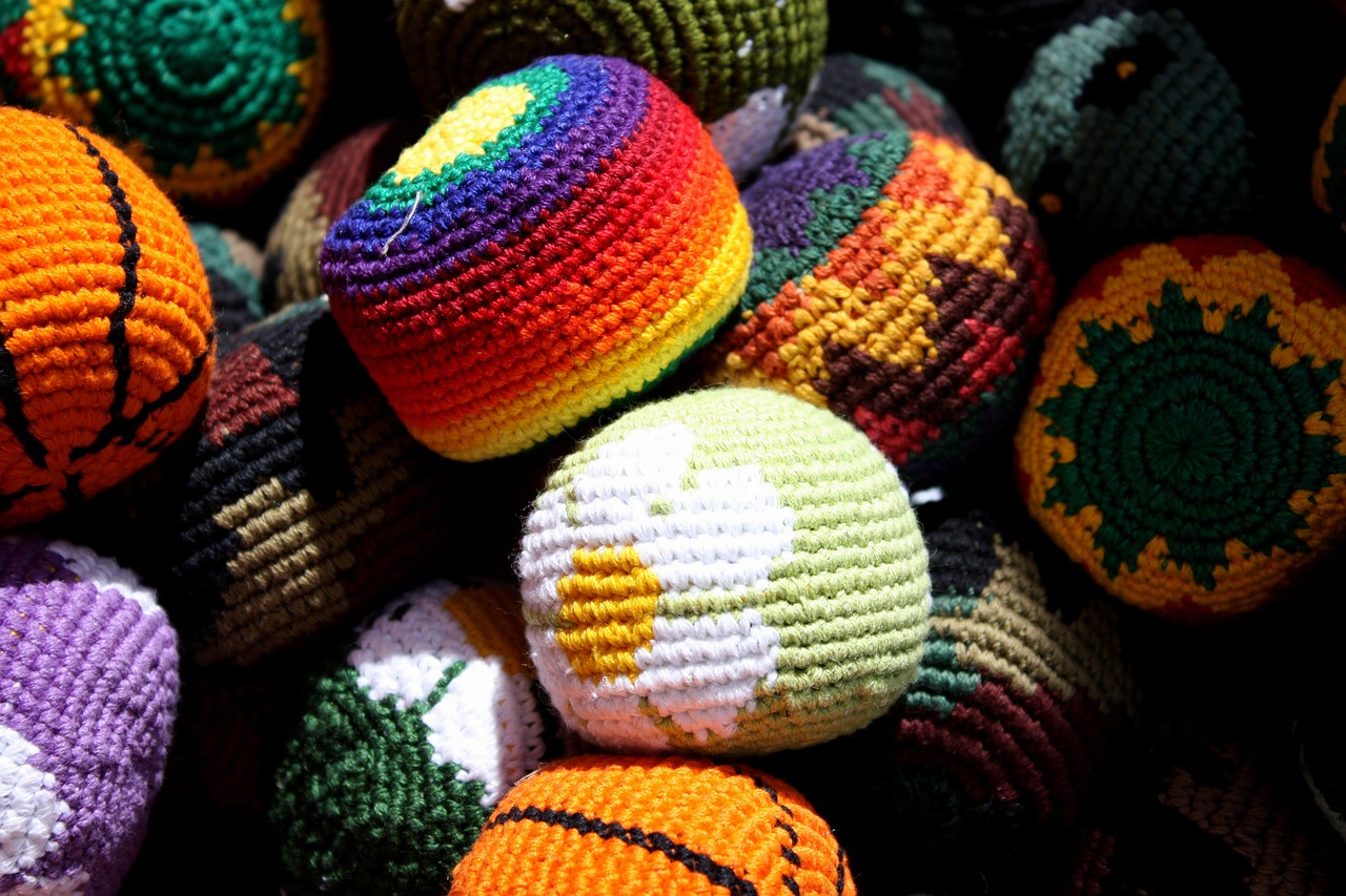 a pile of crocheted balls sitting on top of each other, by Dietmar Damerau, flickr, colors of jamaica, vibrant high contrast, egypt, miscellaneous objects