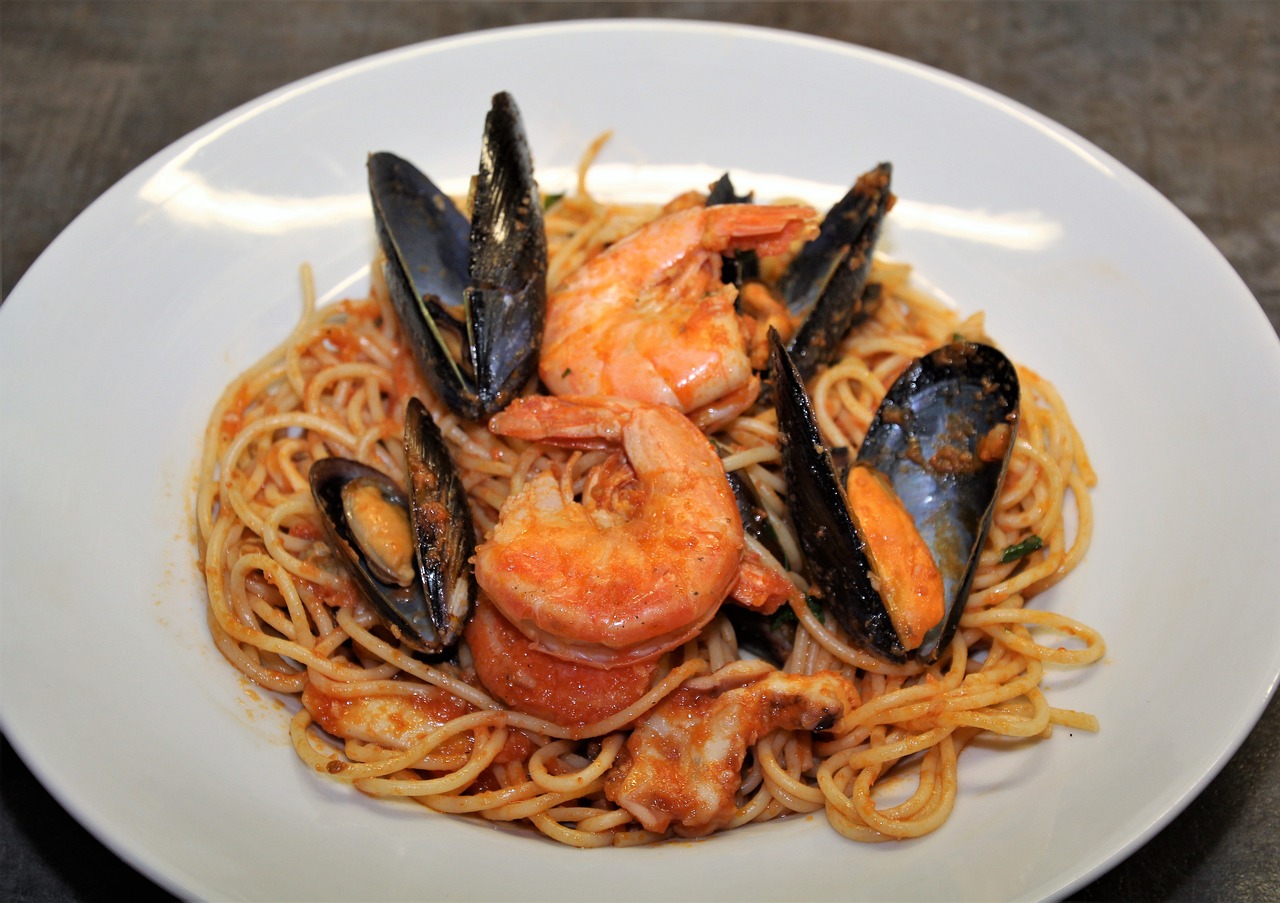 a plate of pasta with shrimp and musselling, 3 4 5 3 1