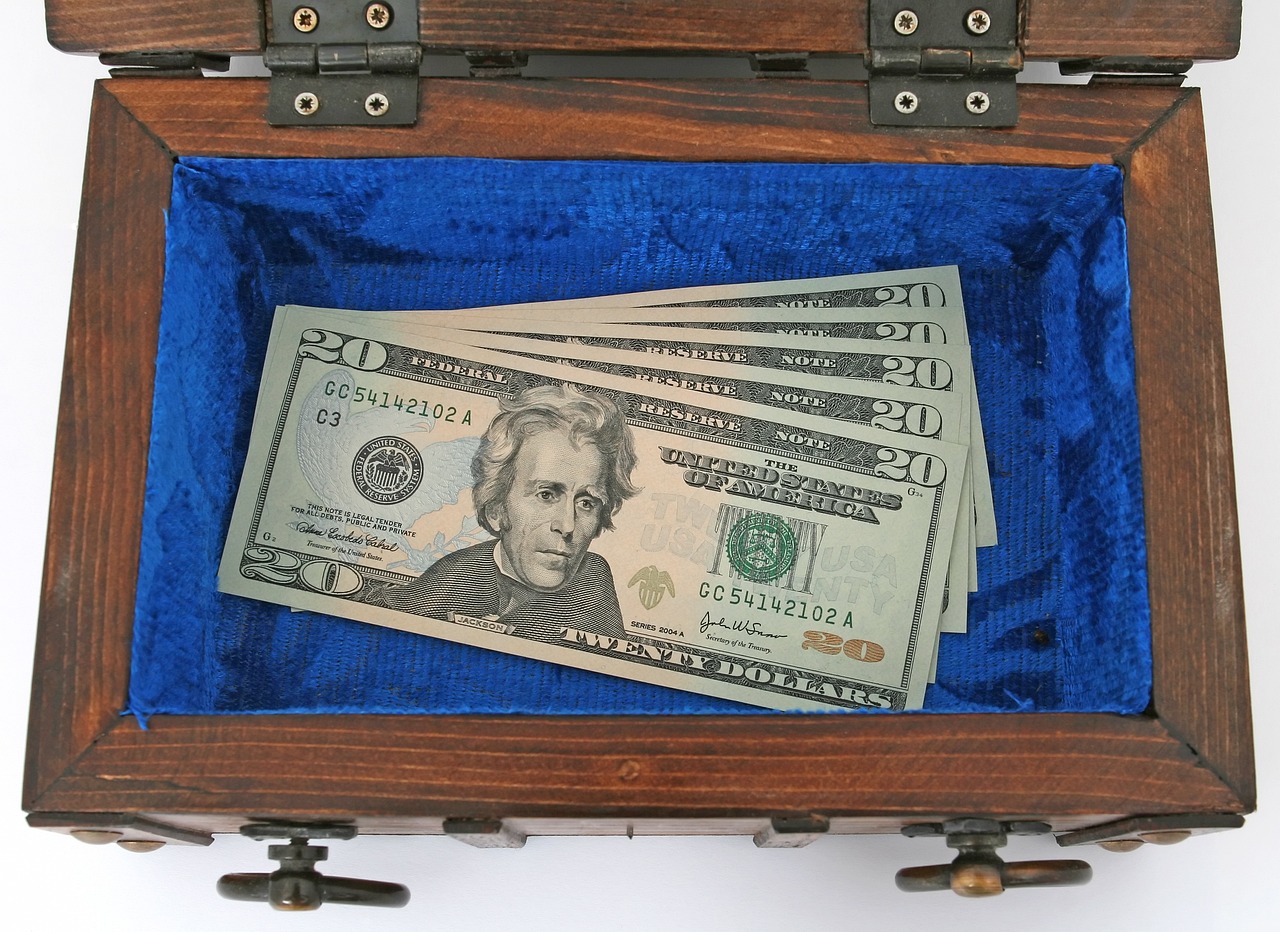 a box filled with money sitting on top of a table, by Ken Elias, in a wooden box. top down photo, case, 2 0
