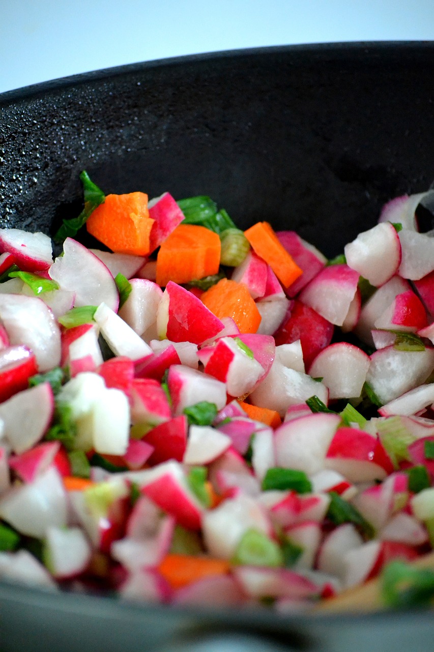 a pan filled with chopped radishes and carrots, a mosaic, inspired by Jacopo Bassano, flickr, closeup 4k, wok, けもの, pink white and green