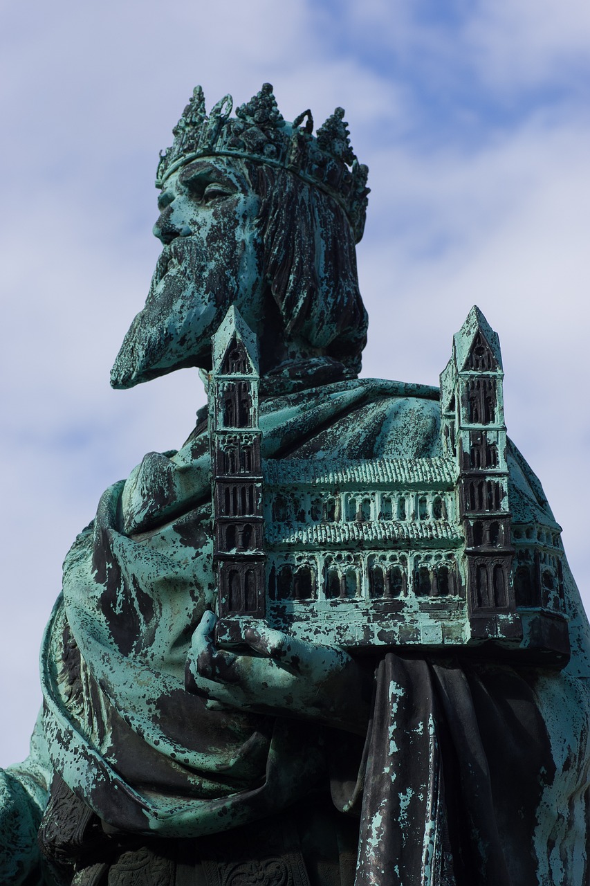 a statue of a man with a crown on his head, a statue, inspired by Taddeo Gaddi, shutterstock, figuration libre, bruegels the tower of babel, stockholm city portrait, in the style of hans thoma, richard iv the roman king photo