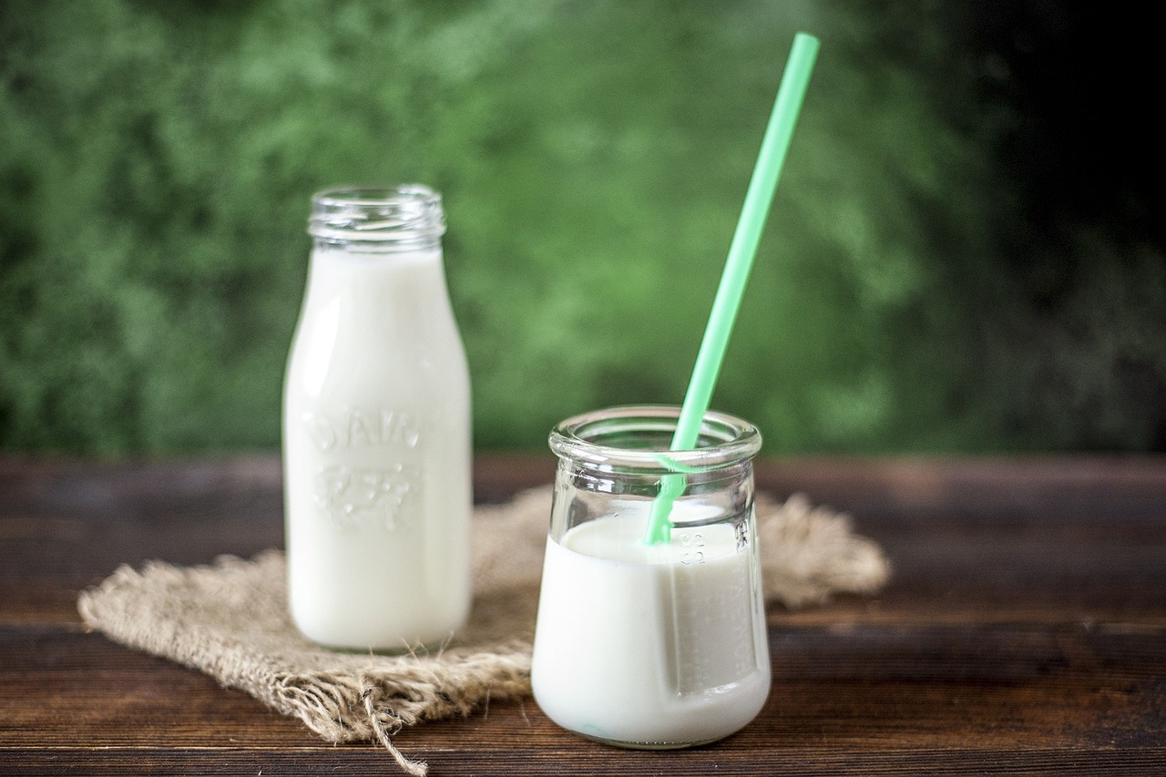 a glass of milk next to a bottle of milk, profile pic, with a straw, high quality product image”, avatar image