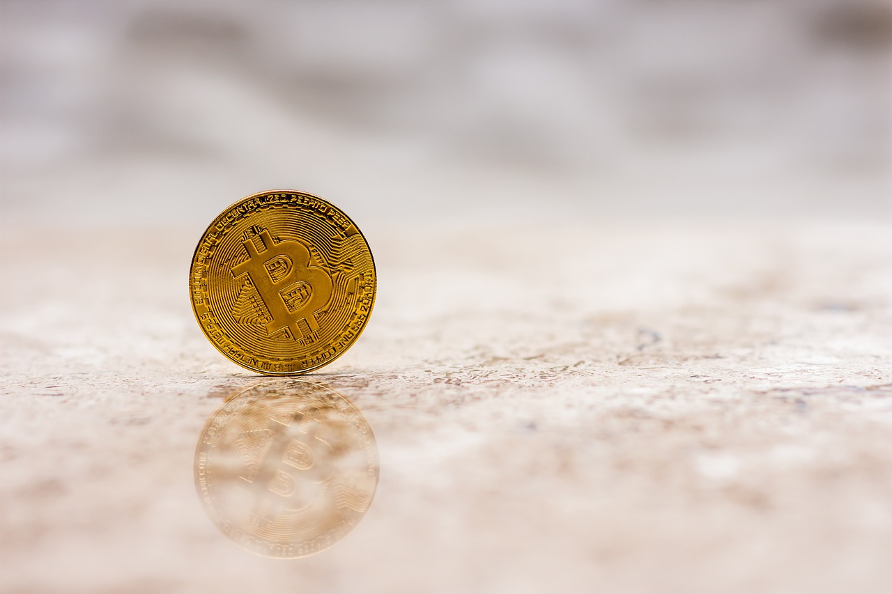 a bit coin sitting on top of a table, a picture, by Anna Katharina Block, unsplash, 🦩🪐🐞👩🏻🦳, stand on stone floor, productphoto, golden number