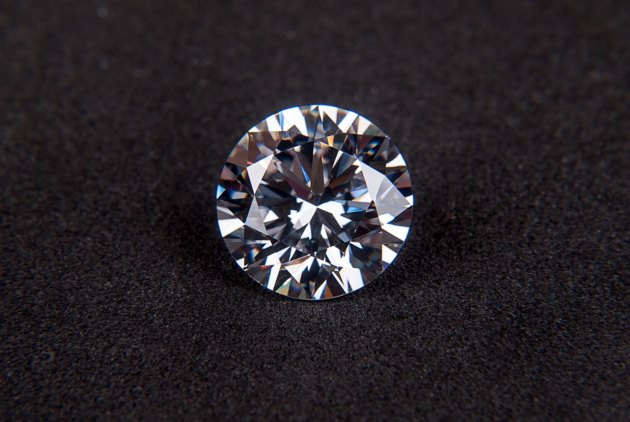 a close up of a diamond on a black surface, miniature product photo, 3 mm, slavic, tian zi