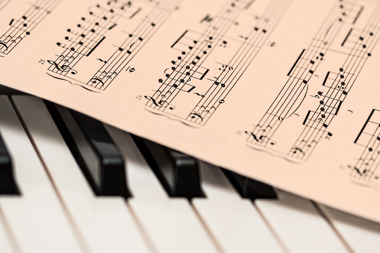 a sheet of music sitting on top of a piano keyboard, pixabay, detailed plans and notes, half image, playful composition, very crisp details