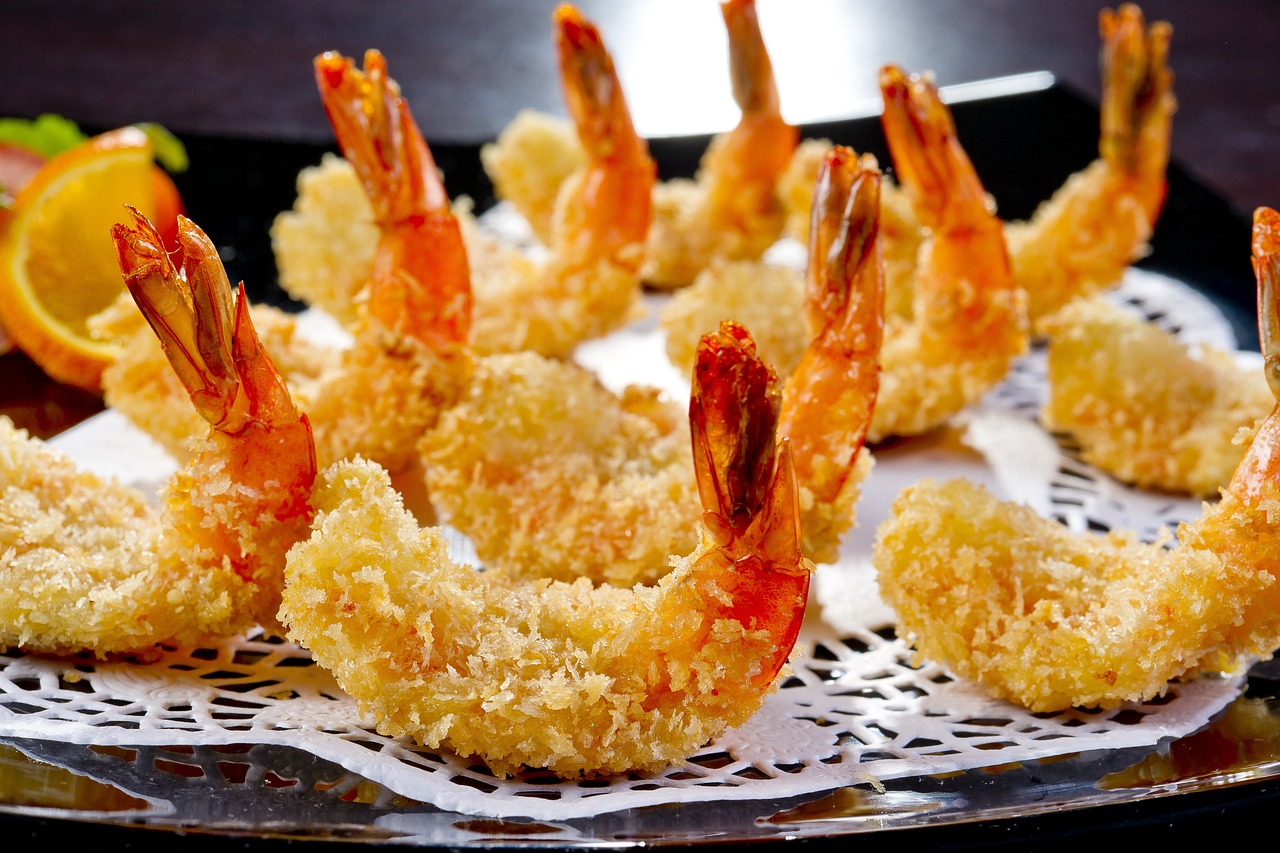 a close up of a plate of food with shrimp, by Miyamoto, shutterstock, very crispy, dessert, sunken, paper