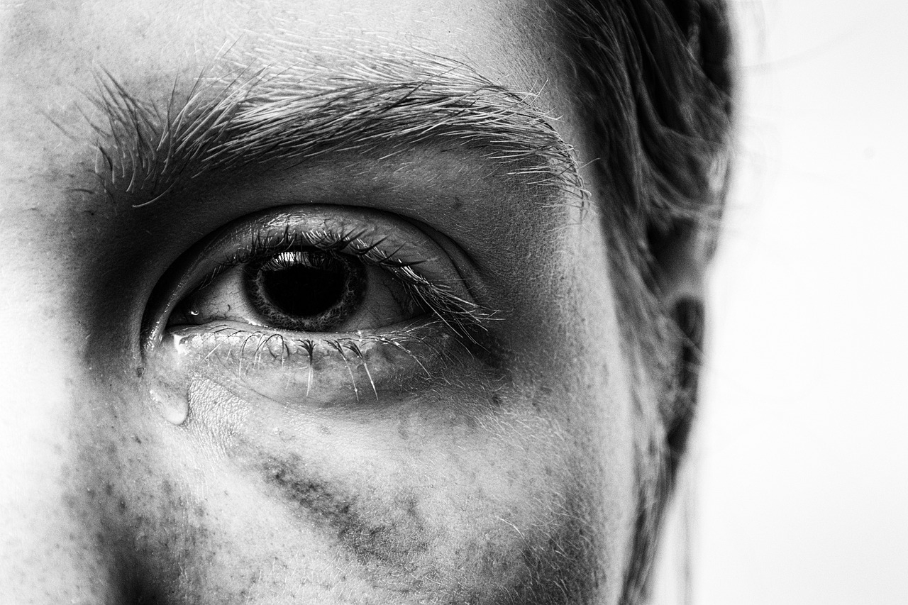 a black and white photo of a man's eye, by Matija Jama, pexels, hyperrealism, woman crying, half face, woman with freckles, hyperrealistic flickr:5