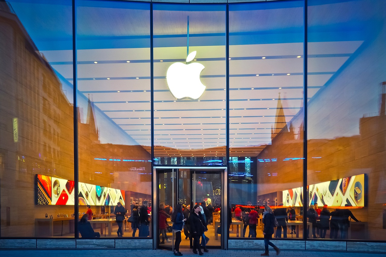 a group of people standing in front of an apple store, a picture, by Douglas Shuler, shutterstock, the window is open, taken in the night, apple car, yellow apples