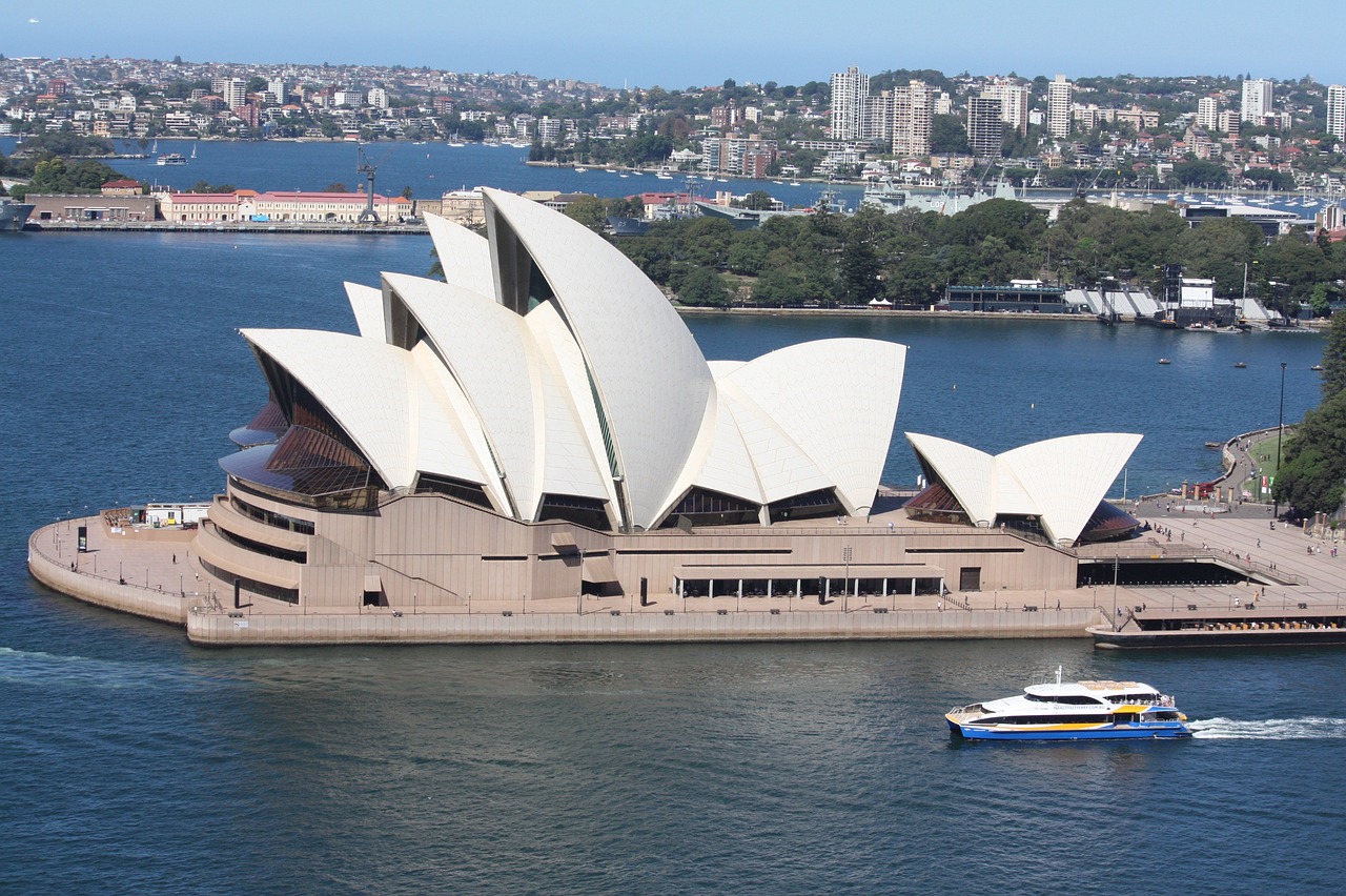 a large building sitting on top of a body of water, inspired by Sydney Carline, shutterstock, boat, close up shot from the top, from wikipedia, 2000s photo