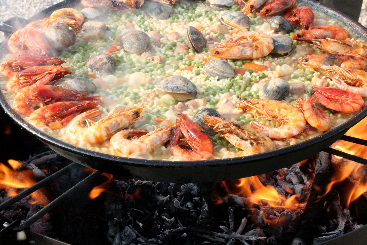 a large pan of food cooking on a grill, by Matteo Pérez, hurufiyya, costa blanca, also very detailed, krakens, green