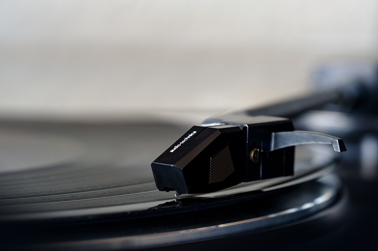 a close up of a record on a turntable, by Steven Belledin, unsplash, shot on canon eos r5, productphoto, packshot, miniature product photo