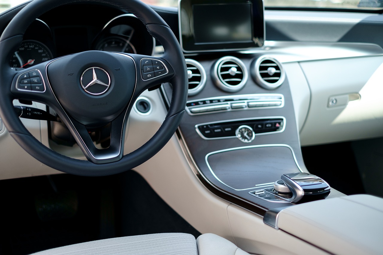 a close up of a steering wheel in a car, mercedez benz, less detailing, beautiful interior, very simple