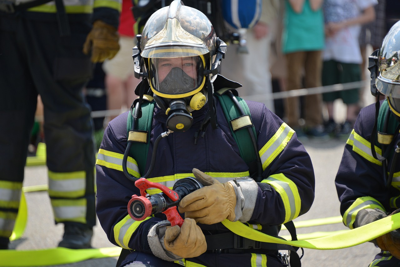 a group of firefighters standing next to each other, a photo, figuration libre, oxygen mask, mid shot photo