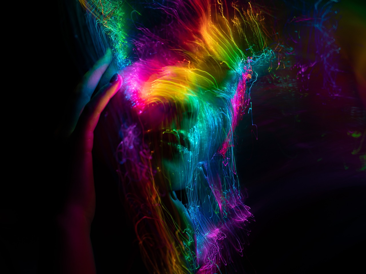 a close up of a person holding a cell phone, inspired by Gabriel Dawe, digital art, electrified hair, splashes of neon, dark rainbow, woman portrait made out of paint