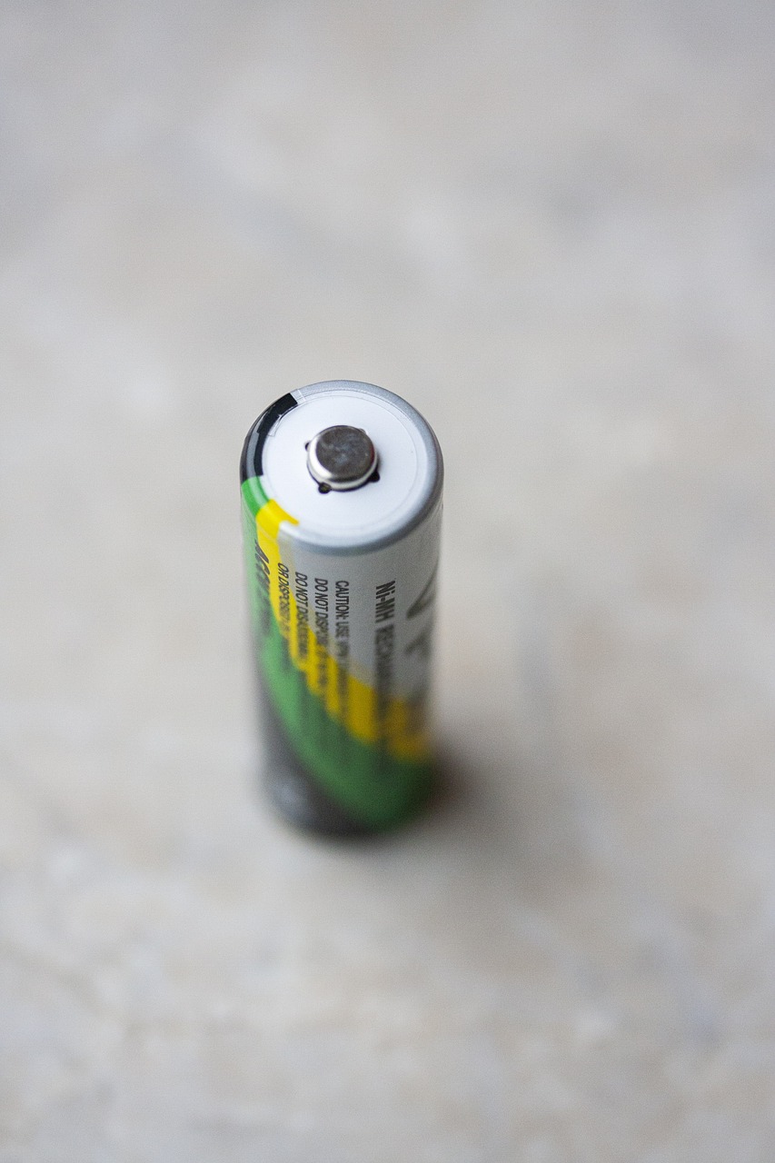 a close up of a battery on a table, a picture, high res photo, turned back to camera, pillar, close up to a skinny