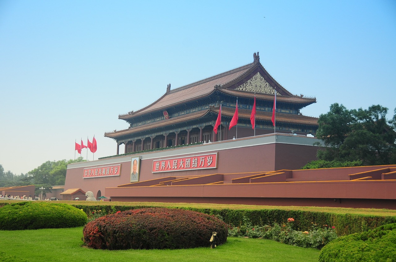 a building with chinese flags in front of it, a picture, flickr, cloisonnism, tiananmen square, huge gate, a park, exhibition