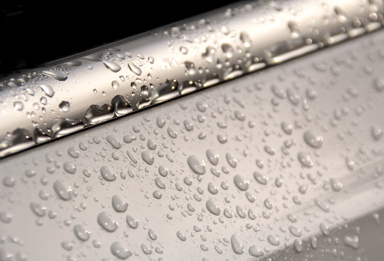 a close up of water droplets on the side of a car, photorealism, pipes, frosted glass, fixing a leaking sink, detailed product photo