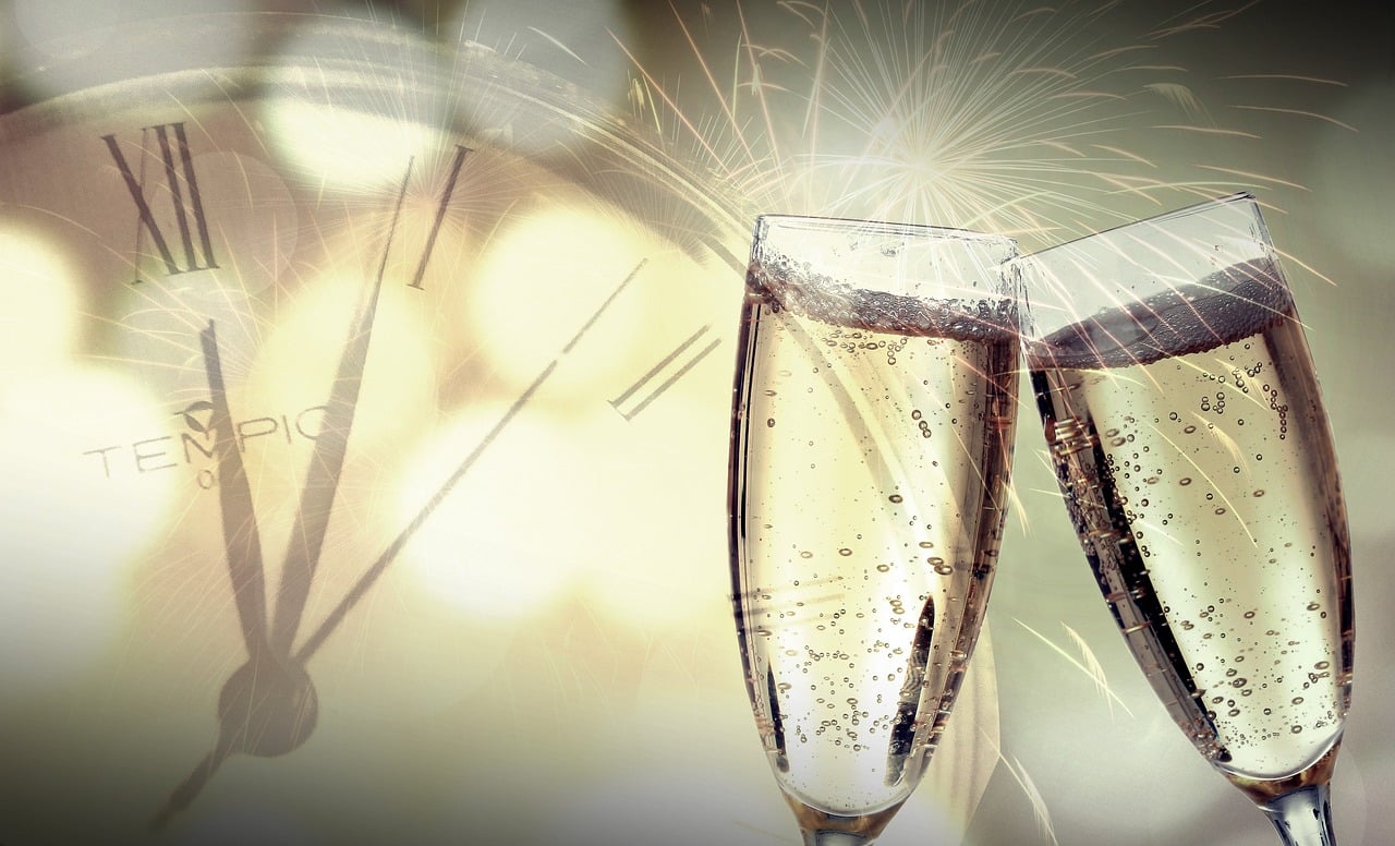 two glasses of champagne with a clock in the background, by Kurt Roesch, trending on pixabay, digital art, fireworks, background image, subtle details, iphone screenshot