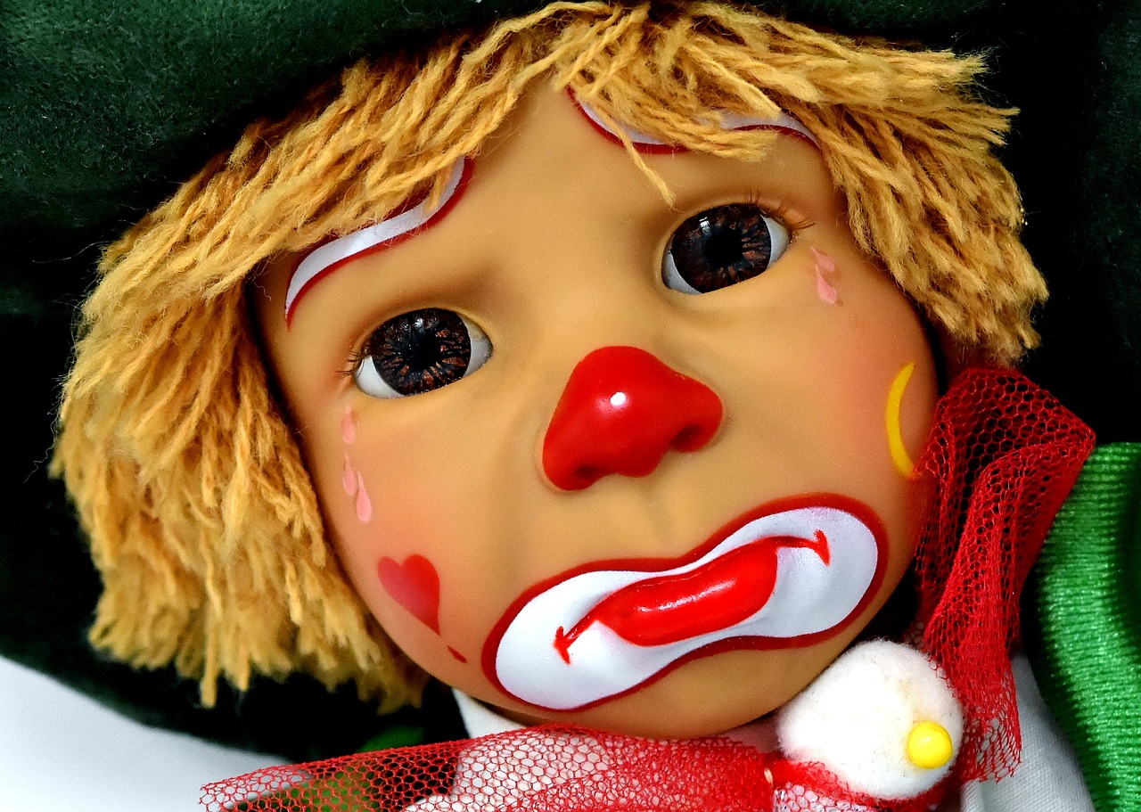 a close up of a doll with a clown face, a picture, by Edward Corbett, trending on pixabay, caramel, crying eyes closed!, detailed face!, holiday season