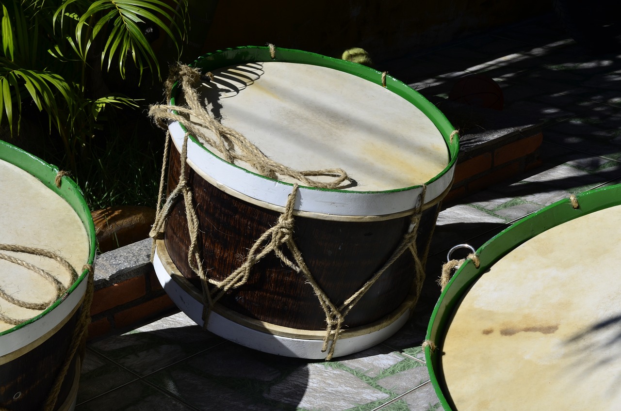 a couple of drums sitting on top of a table, inspired by Balázs Diószegi, shutterstock, hurufiyya, straps, in the yard, high details photo, bamboo