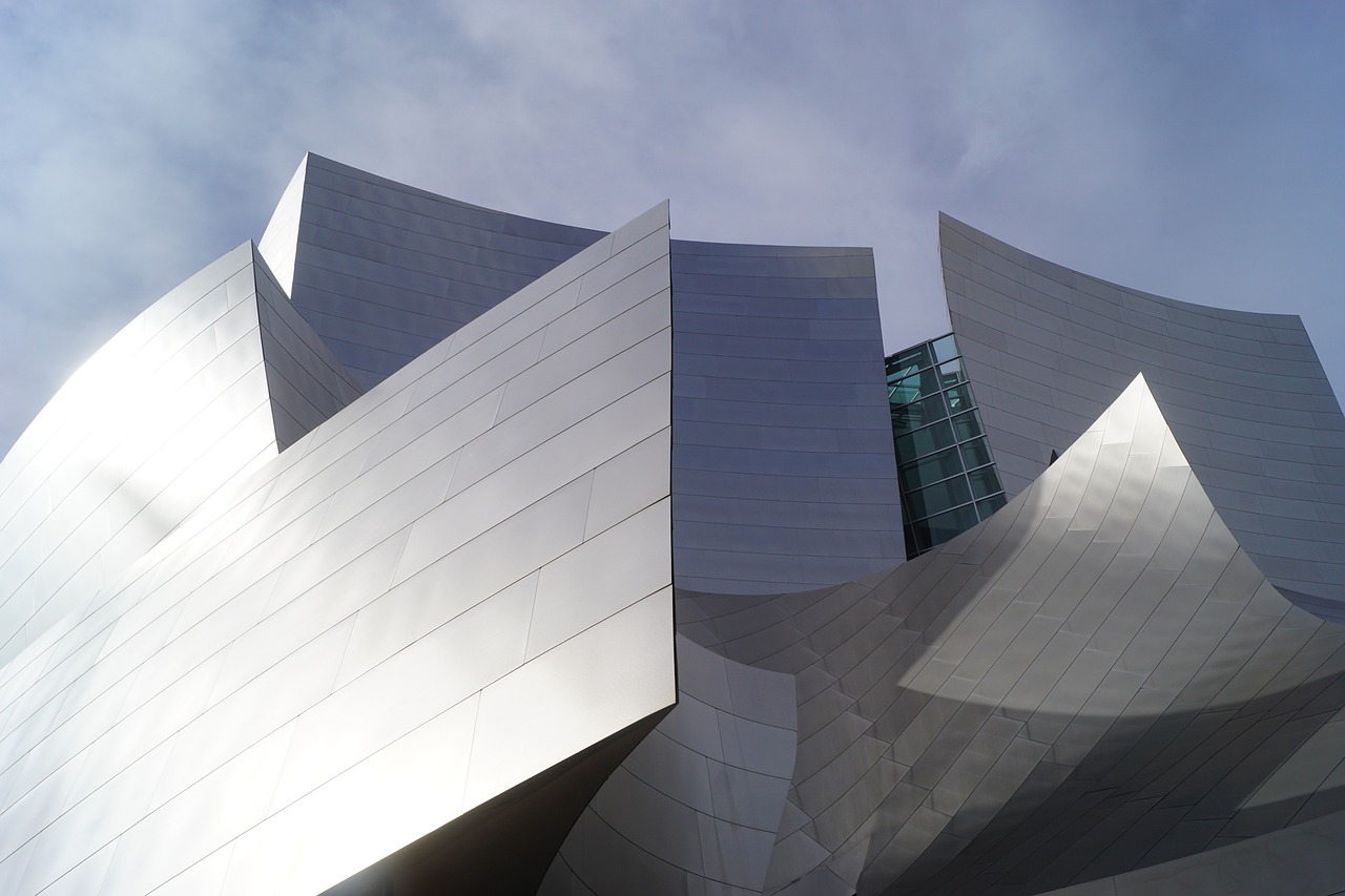 a close up of a building with a sky background, inspired by Zaha Hadid, modernism, !dream los angeles, symphony, jagged metal landscape, a middle-shot from front