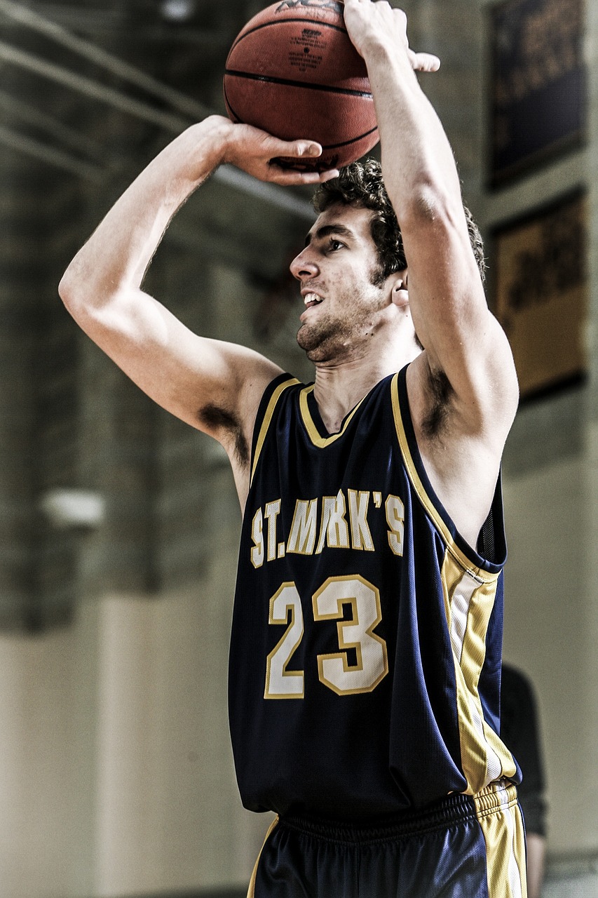 a man shooting a basketball during a game, a picture, by Simon Marmion, flickr, photorealism, athletic tall handsome guys, saint, college, eng kilian