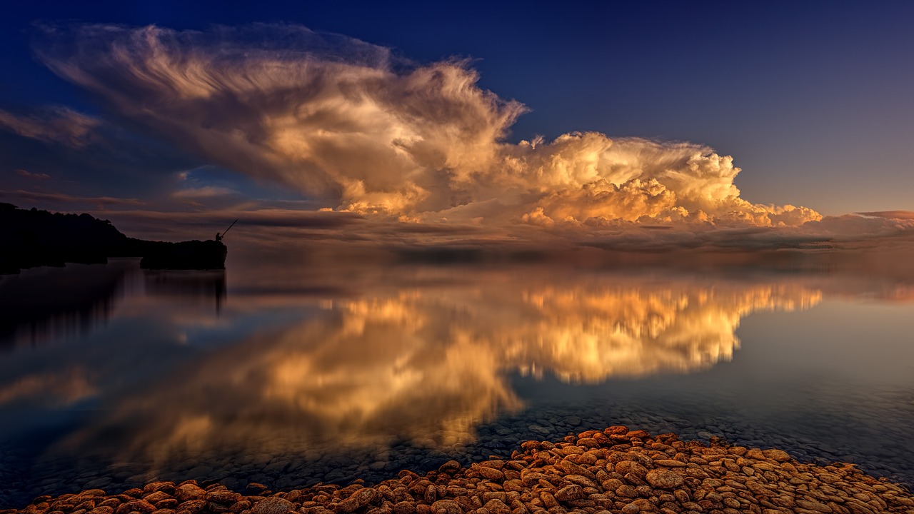 a body of water surrounded by rocks under a cloudy sky, a picture, romanticism, golden clouds, incredible reflections, giant cumulonimbus cloud, summer night