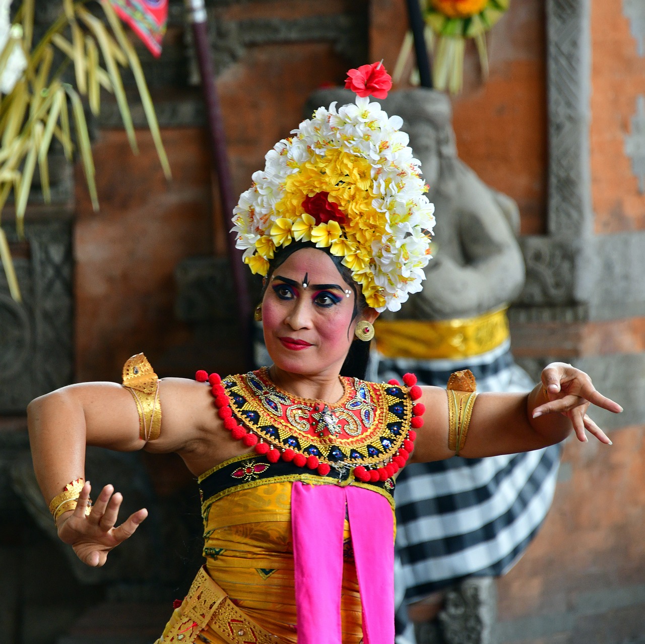 a close up of a person in a costume, inspired by I Ketut Soki, pexels, she is dancing. realistic, indian temple, flower, centered in portrait