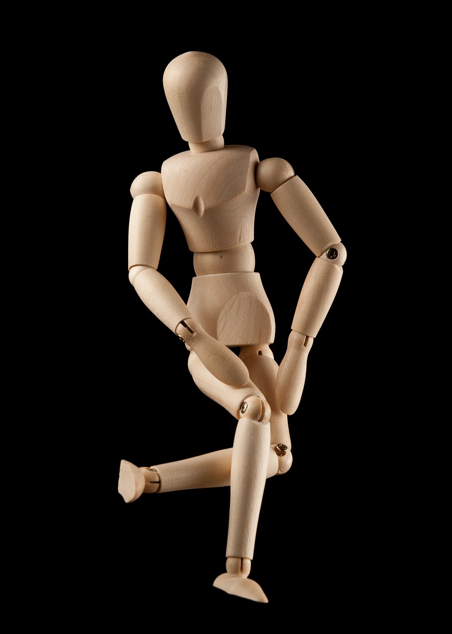 a wooden mannequin standing in front of a black background, visual art, dynamic active running pose, knees weak, cute funny figurine wooden, contorted