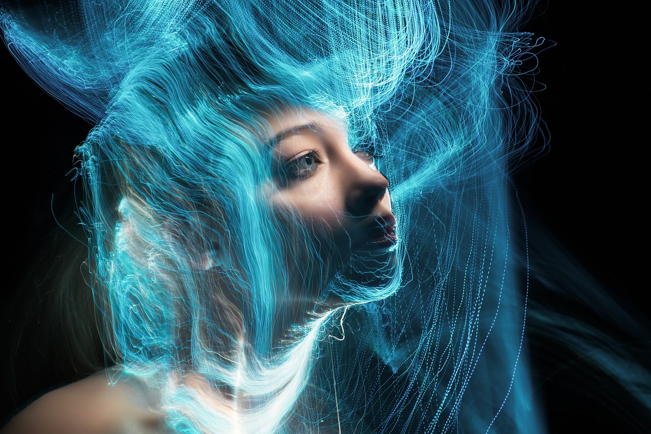 a close up of a woman with blue hair, inspired by Alberto Seveso, digital art, glowing thing wires, lightpainting motion blur, glowwave girl portrait, she is floating in the air