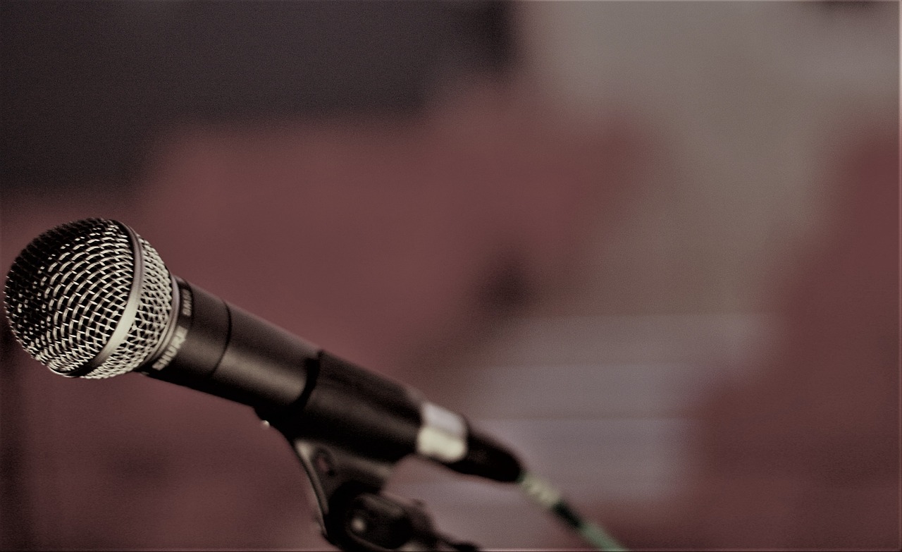 a close up of a microphone on a stand, a portrait, by Ejnar Nielsen, unsplash, digital art, banner, shot on nikon d 3 2 0 0, worship, table with microphones