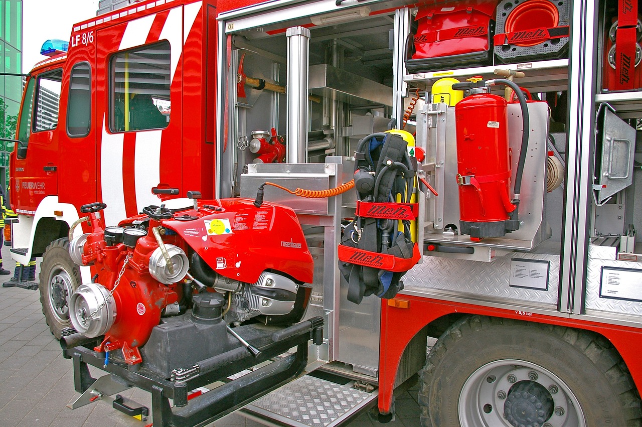 a man that is standing in the back of a fire truck, a picture, by Robert Zünd, shutterstock, figuration libre, high technical detail, system unit, high detailed photo, aluminium