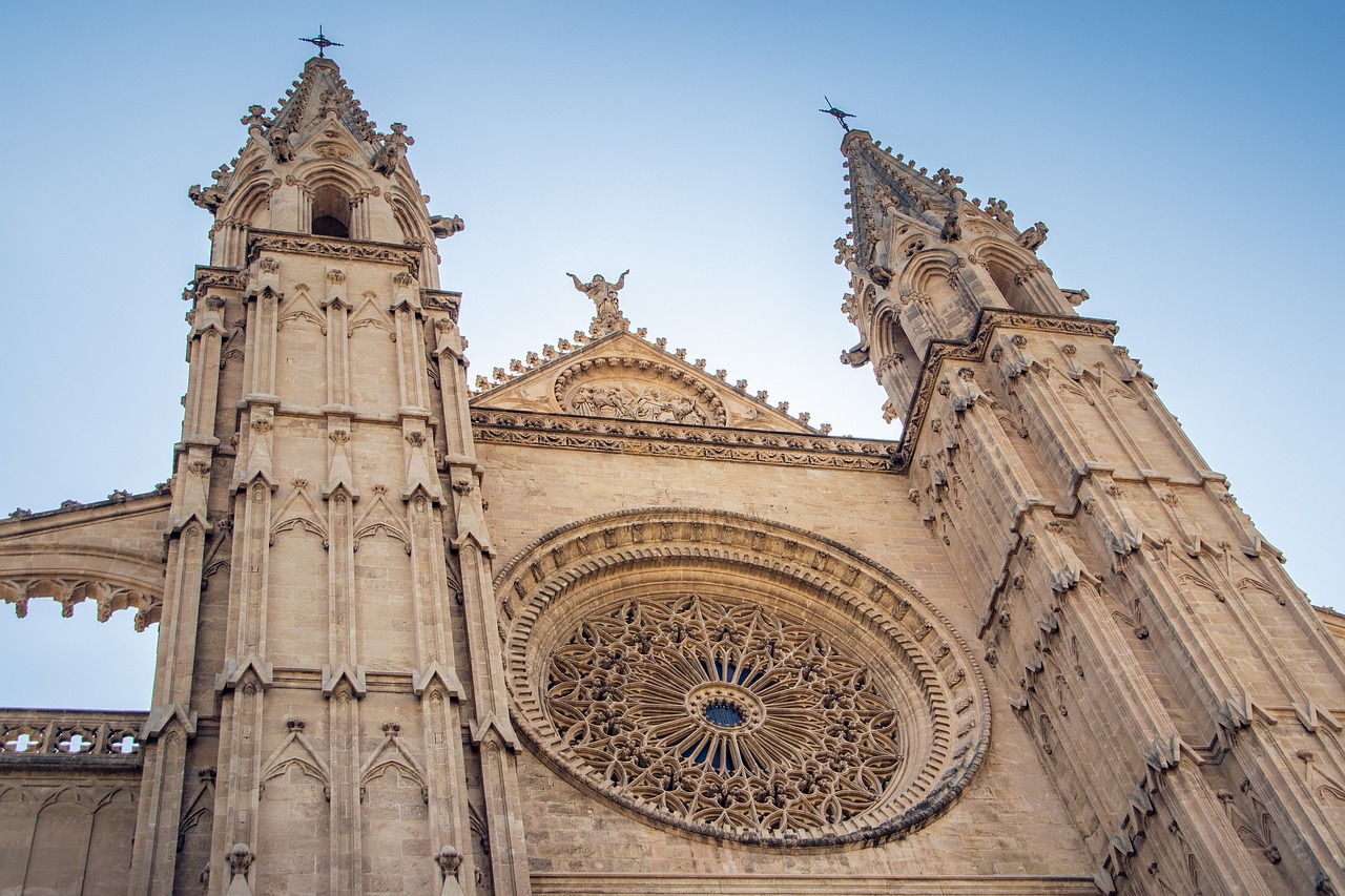 a very tall cathedral with a clock on it's side, by Fede Galizia, shutterstock, intricate stone carvings, three towers, highly detail wide angle photo, stock photo