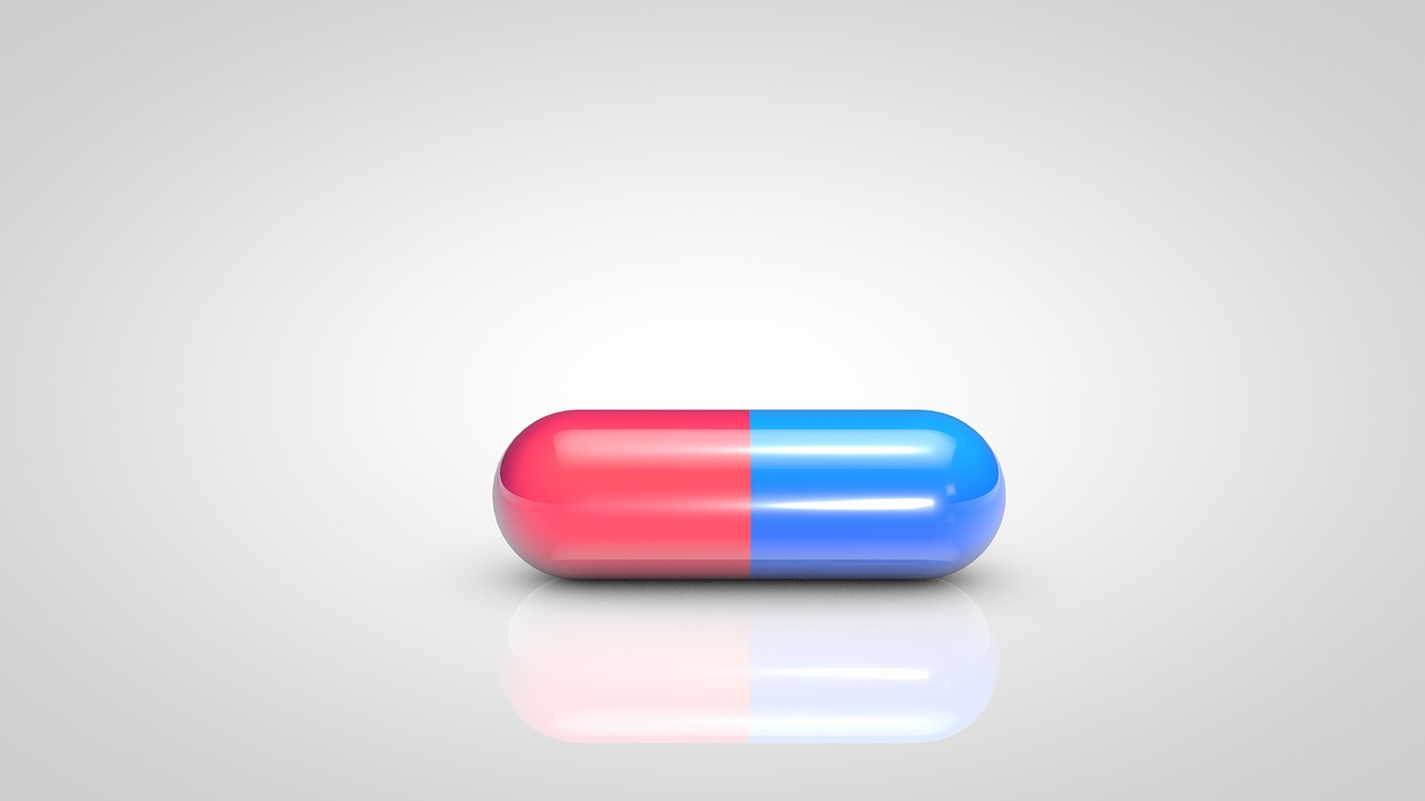 a red and blue pill sitting on top of a white surface, a picture, on a gray background, pink and blue gradients, high res photo, medical illustration