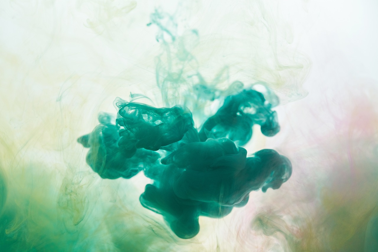 a close up of a green substance in water, inspired by Kim Keever, abstract expressionism, teal studio backdrop, ink blot, color image, view from the bottom