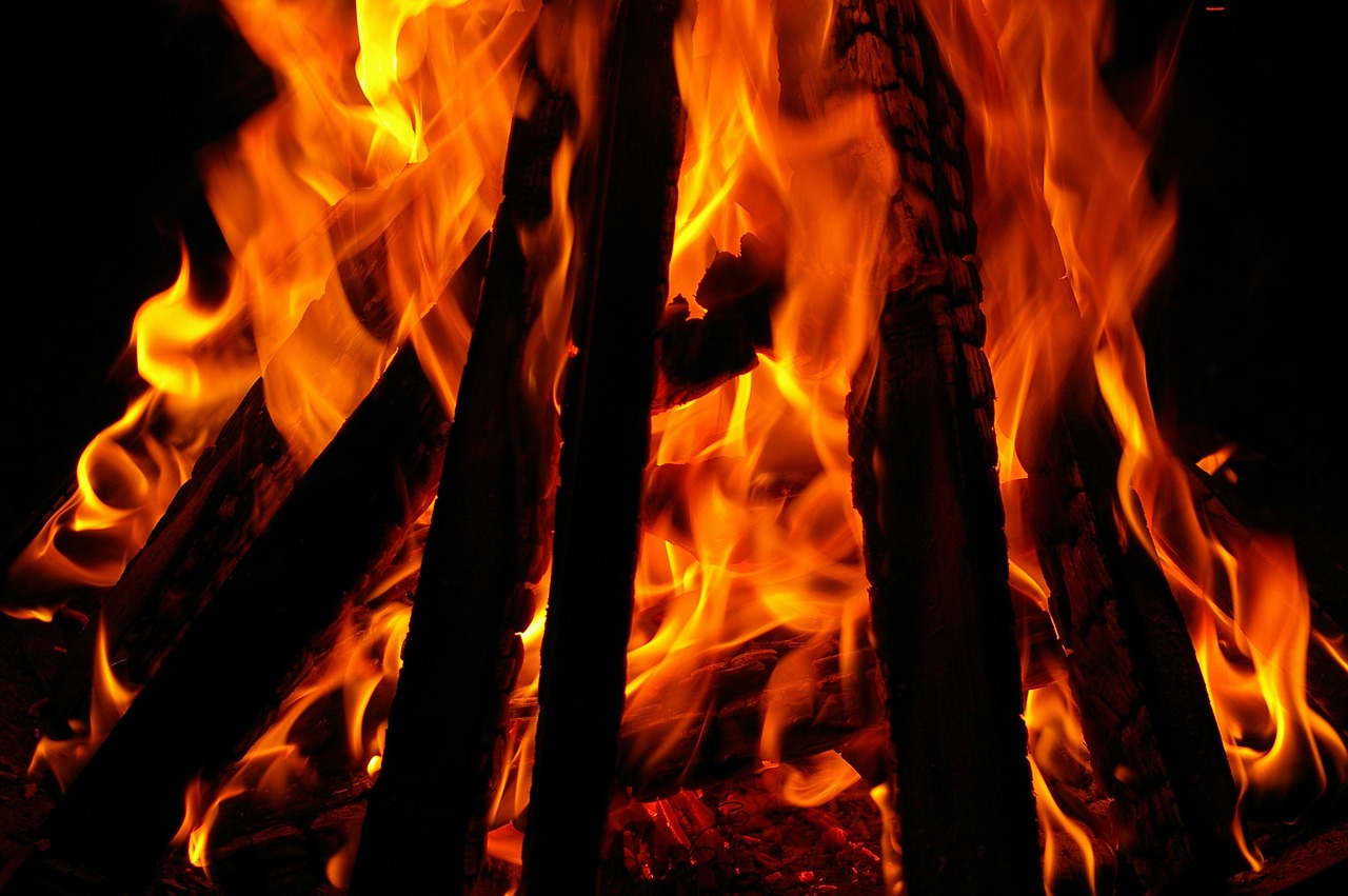 a close up of a fire in the dark, a picture, by Rodney Joseph Burn, istockphoto, a wooden, shot from below, flamboyant