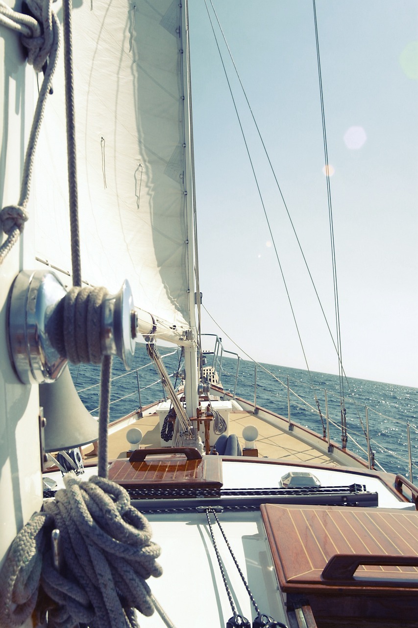 a close up of a sail boat on a body of water, a picture, by Karl Buesgen, relaxing on a yacht at sea, view up, winding horn, tiffany dover