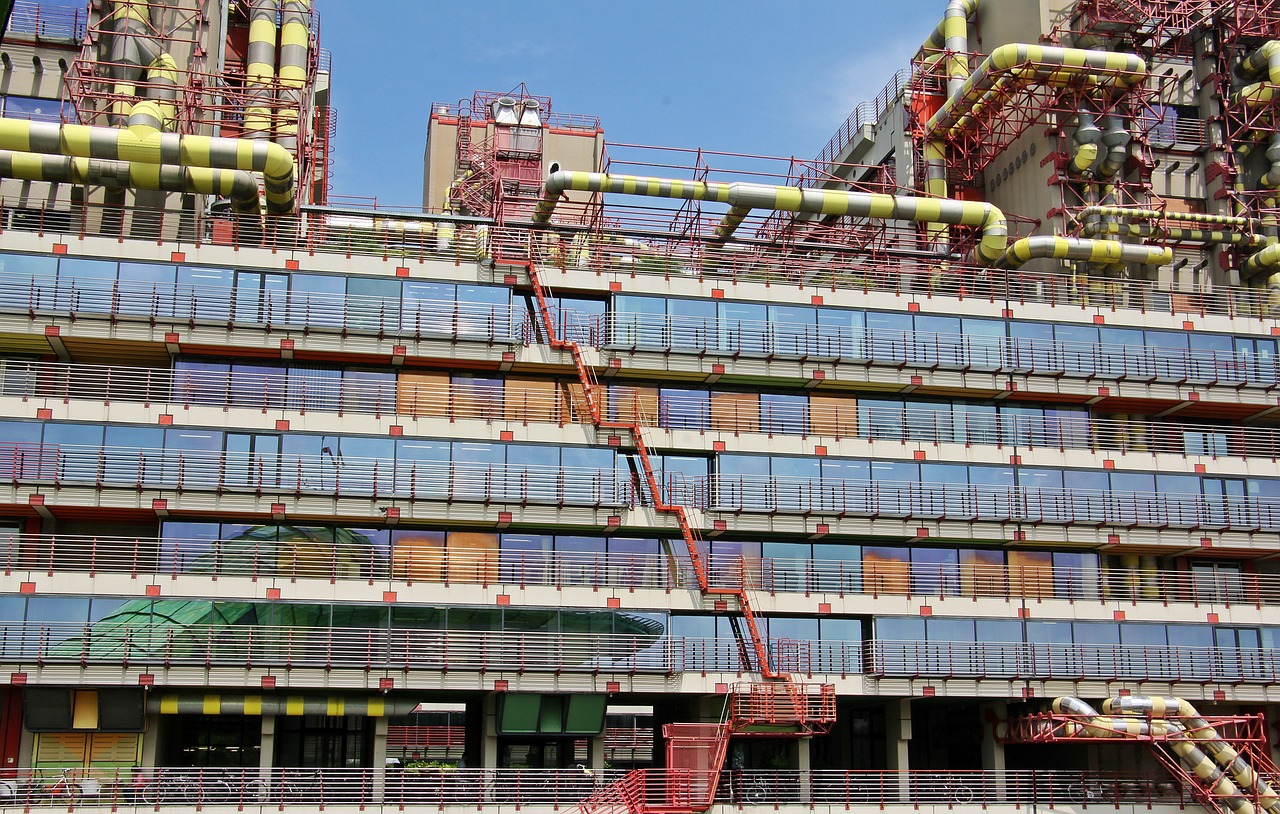 a large building with a bunch of pipes on top of it, by Werner Gutzeit, flickr, external staircases, red and yellow scheme, high technology inplants, steel window mullions