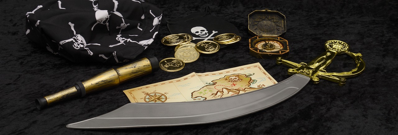 a close up of a knife on a table, pirates treasure map, gold decorations, product display photograph, coin