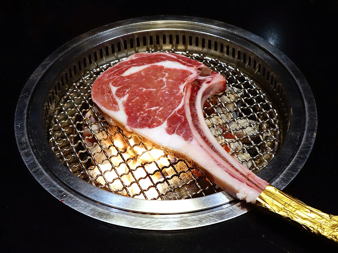 a piece of meat sitting on top of a grill, shin hanga, shin jeongho, gape, round head, lifestyle