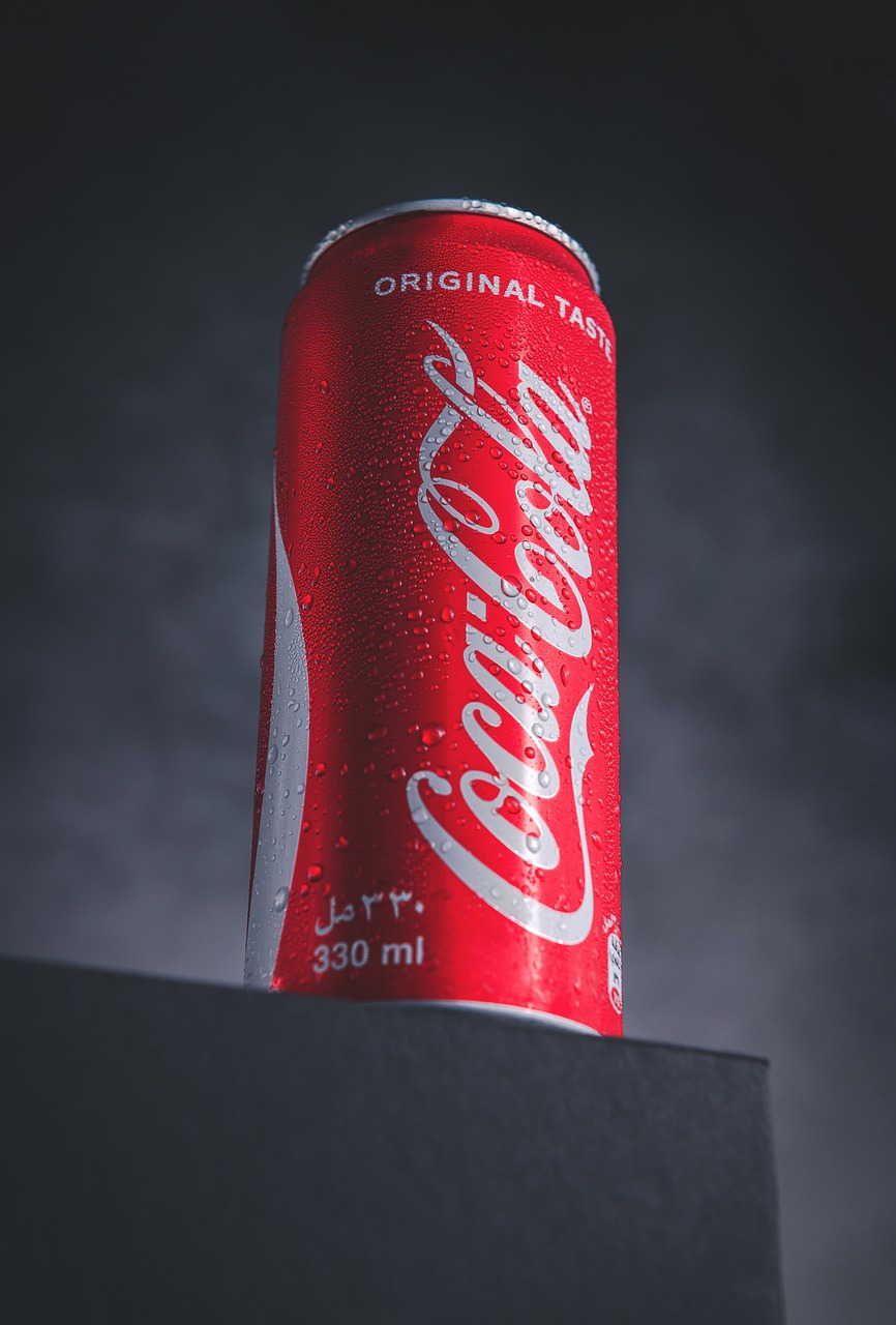 a can of coke sitting on top of a table, by Tom Wänerstrand, unsplash, hyperrealism, standing with a black background, productphoto, taken on iphone 1 3 pro, really realistic