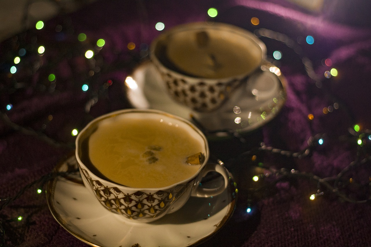 two cups of soup sitting on top of a saucer, a portrait, inspired by Slava Raškaj, flickr, hurufiyya, festive atmosphere, caramel, sparkle, ayahuasca