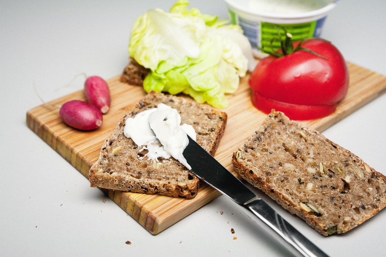 a couple of slices of bread sitting on top of a cutting board, a picture, bauhaus, cutting a salad, foodphoto, flax, listing image