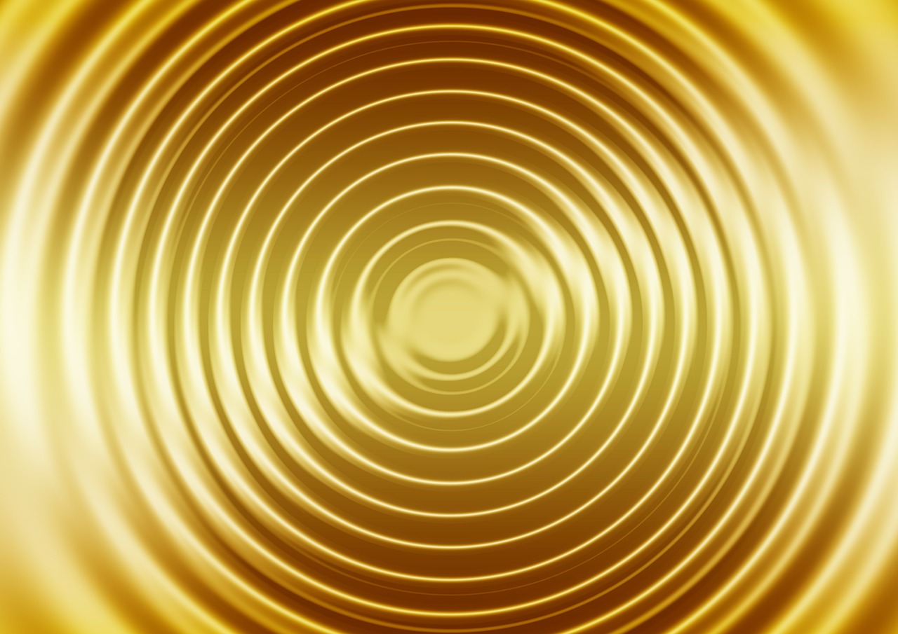 a close up of a circular object on a yellow background, digital art, op art, shiny gold background, very soft diffuse lights, phone photo, high res photo