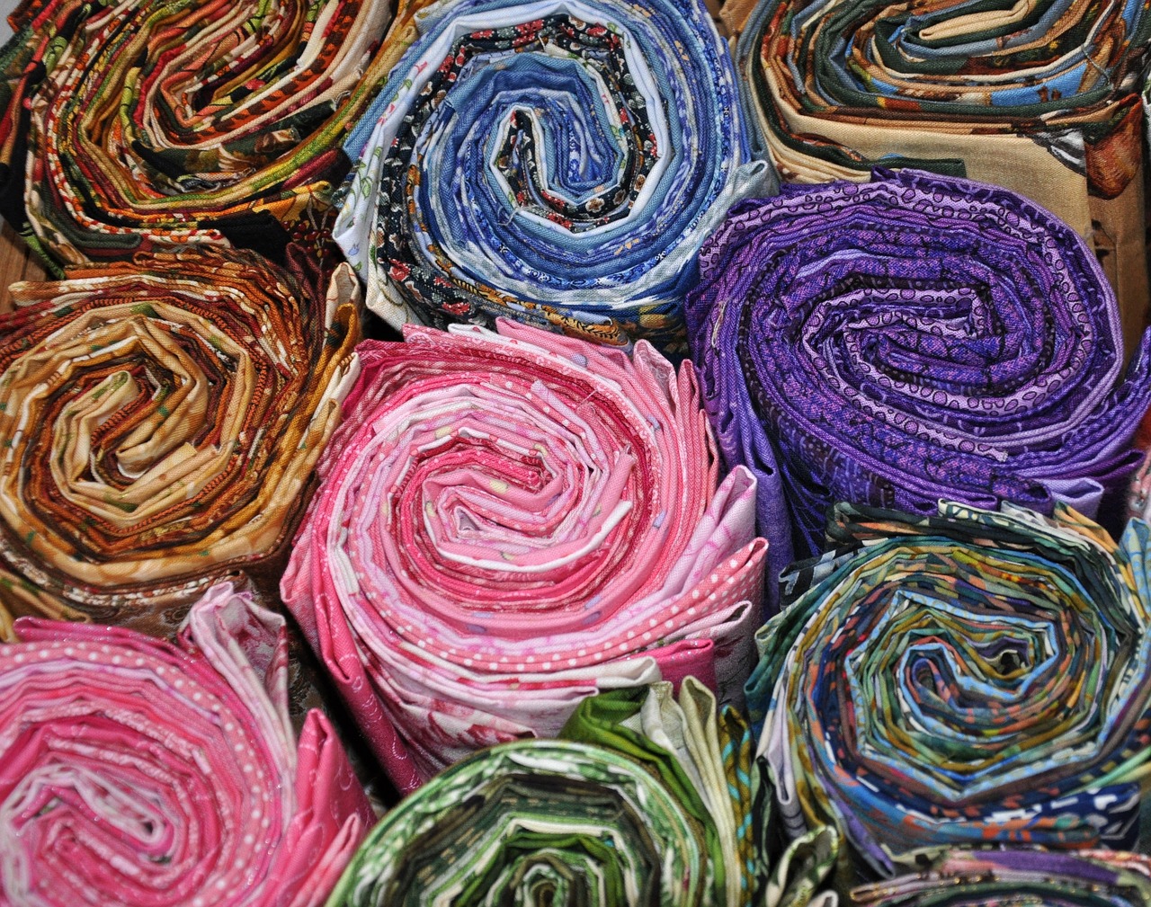 a box filled with lots of different colored fabric, flickr, spiral, legendary masterpiece, yukata clothing, ripped fabric