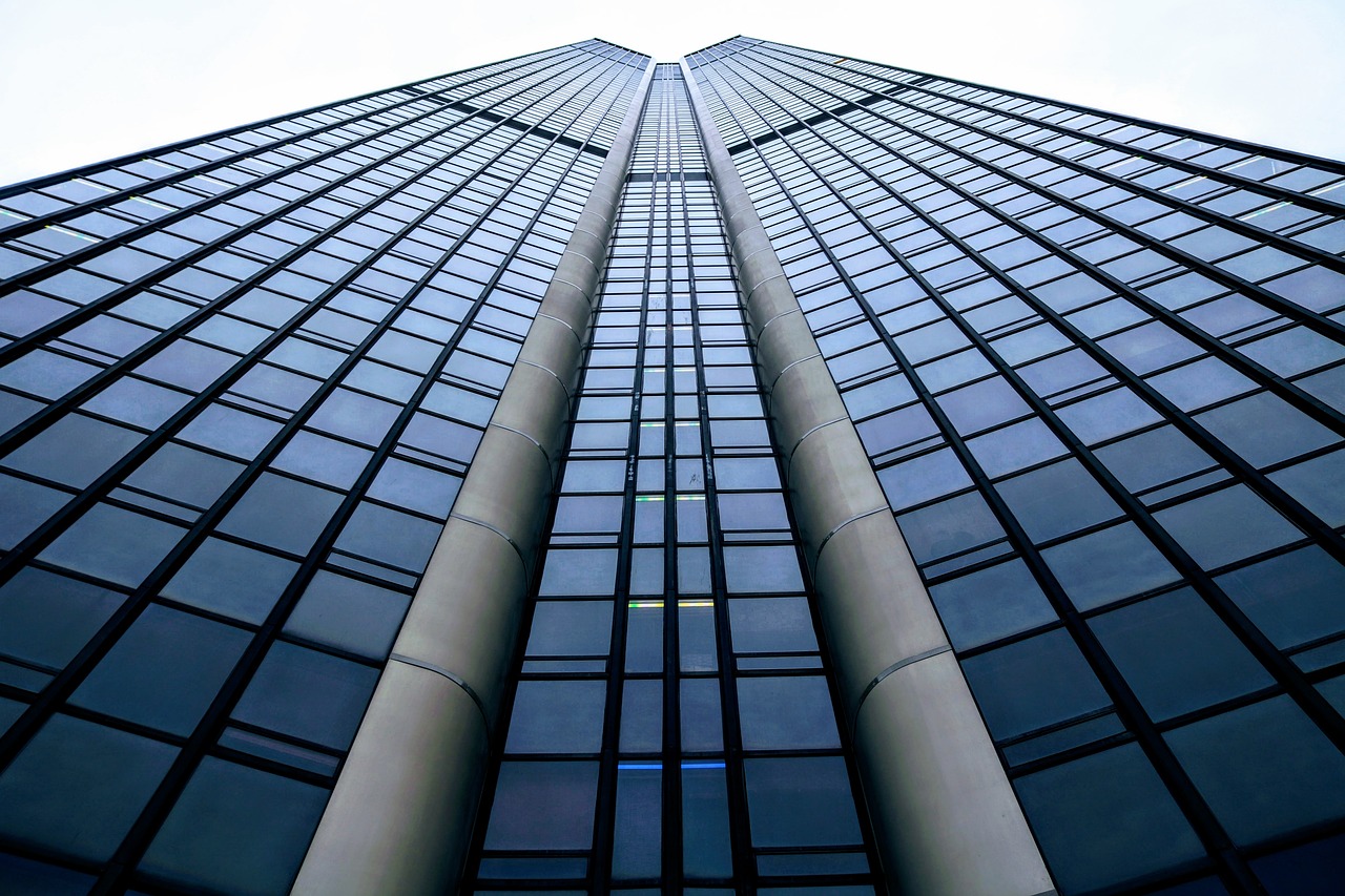 a very tall building with lots of windows, by Jakob Gauermann, shutterstock, vanishing point perspective, tall obsidian architecture, vertical lines, very sharp details