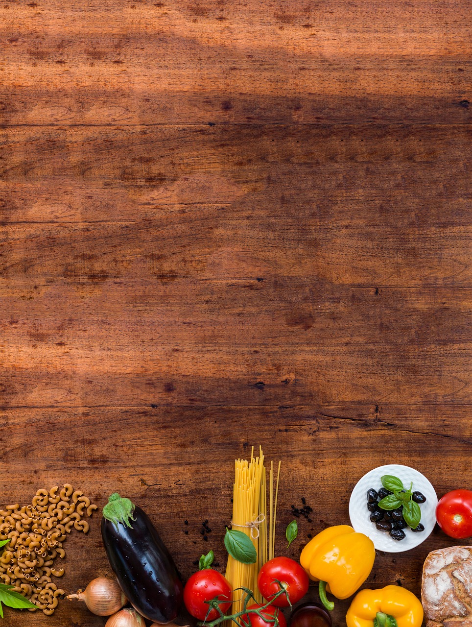 a wooden table topped with lots of different types of food, a stock photo, realism, background image, spaghetti, seeds, framing