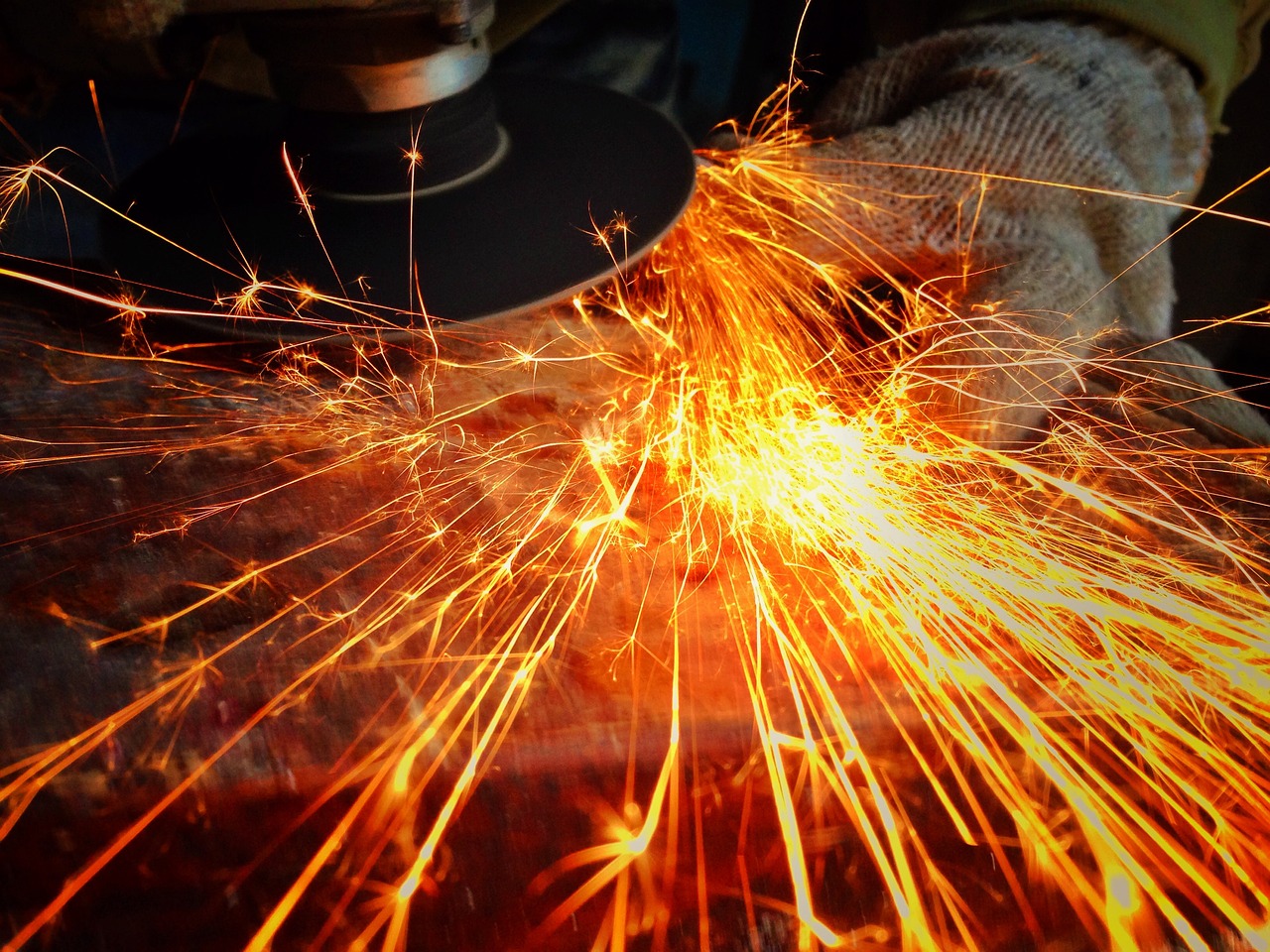 a person using a grinder on a piece of metal, pexels, auto-destructive art, istock, fireworks, modern very sharp photo, stock photo