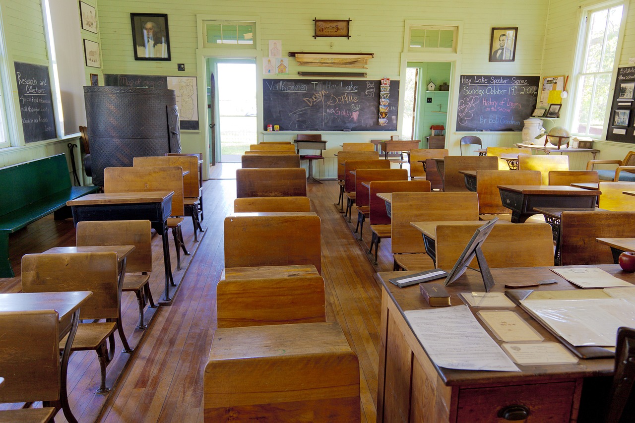 a classroom filled with lots of wooden desks and chairs, a portrait, by Wayne England, pixabay, northwest school, chalkboard, victorian era, tx, about to step on you